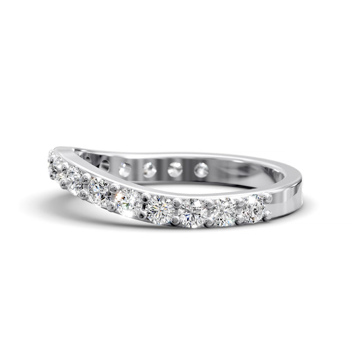 Curved half eternity diamond band with prong set round stones in polished gold
