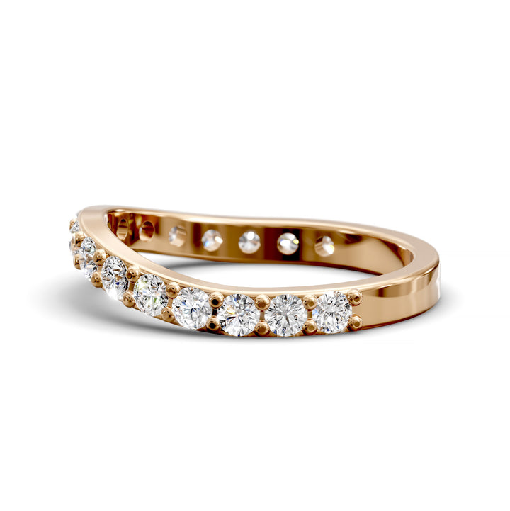 Curved half eternity diamond band with prong set round stones in polished gold