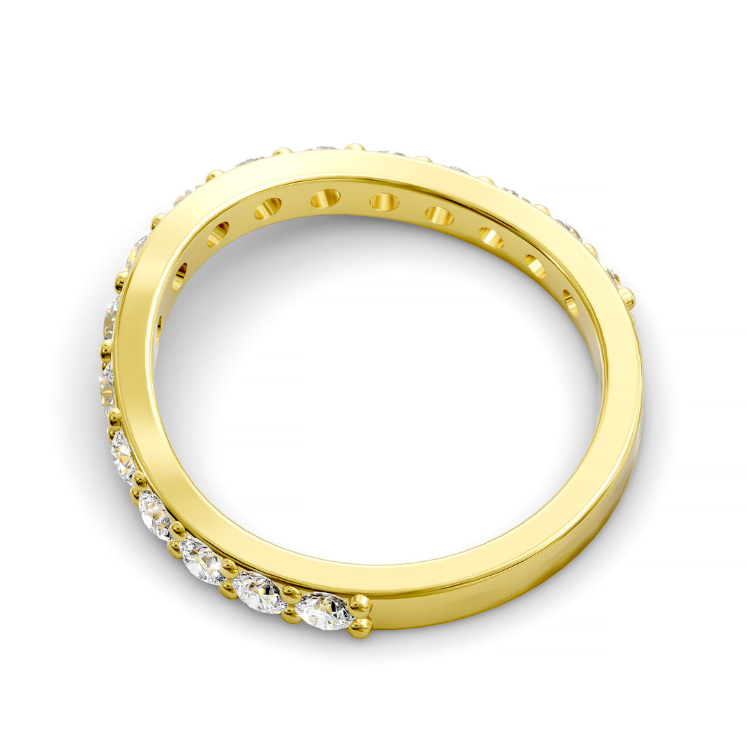 Curved half eternity diamond band with prong set round stones in polished gold
