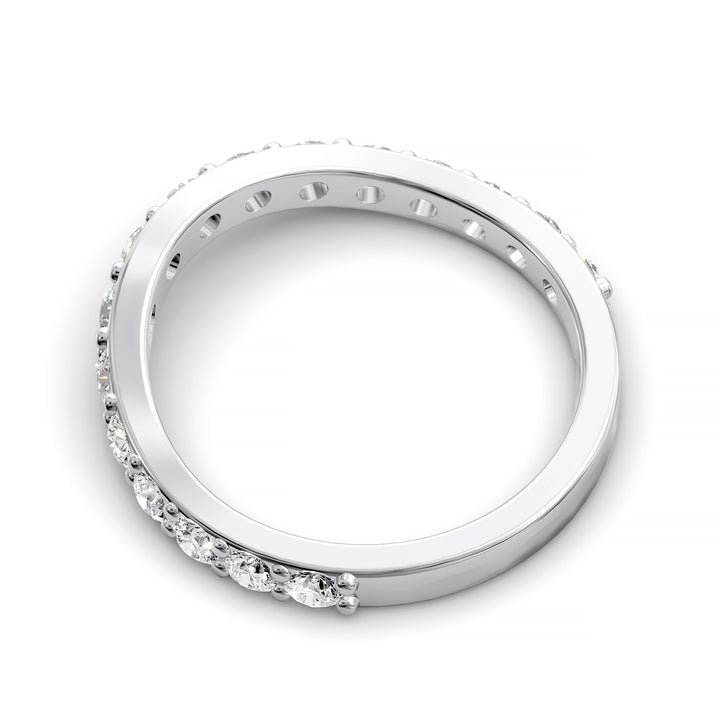 Curved half eternity diamond band with prong set round stones in polished gold