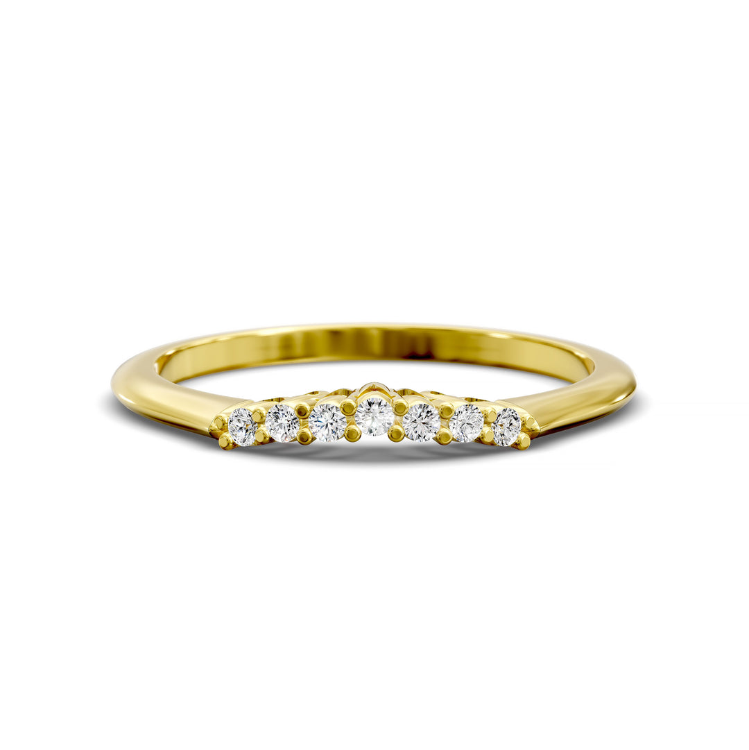 Curved diamond wedding band with shared-prong setting and open gallery, featuring seven round stones