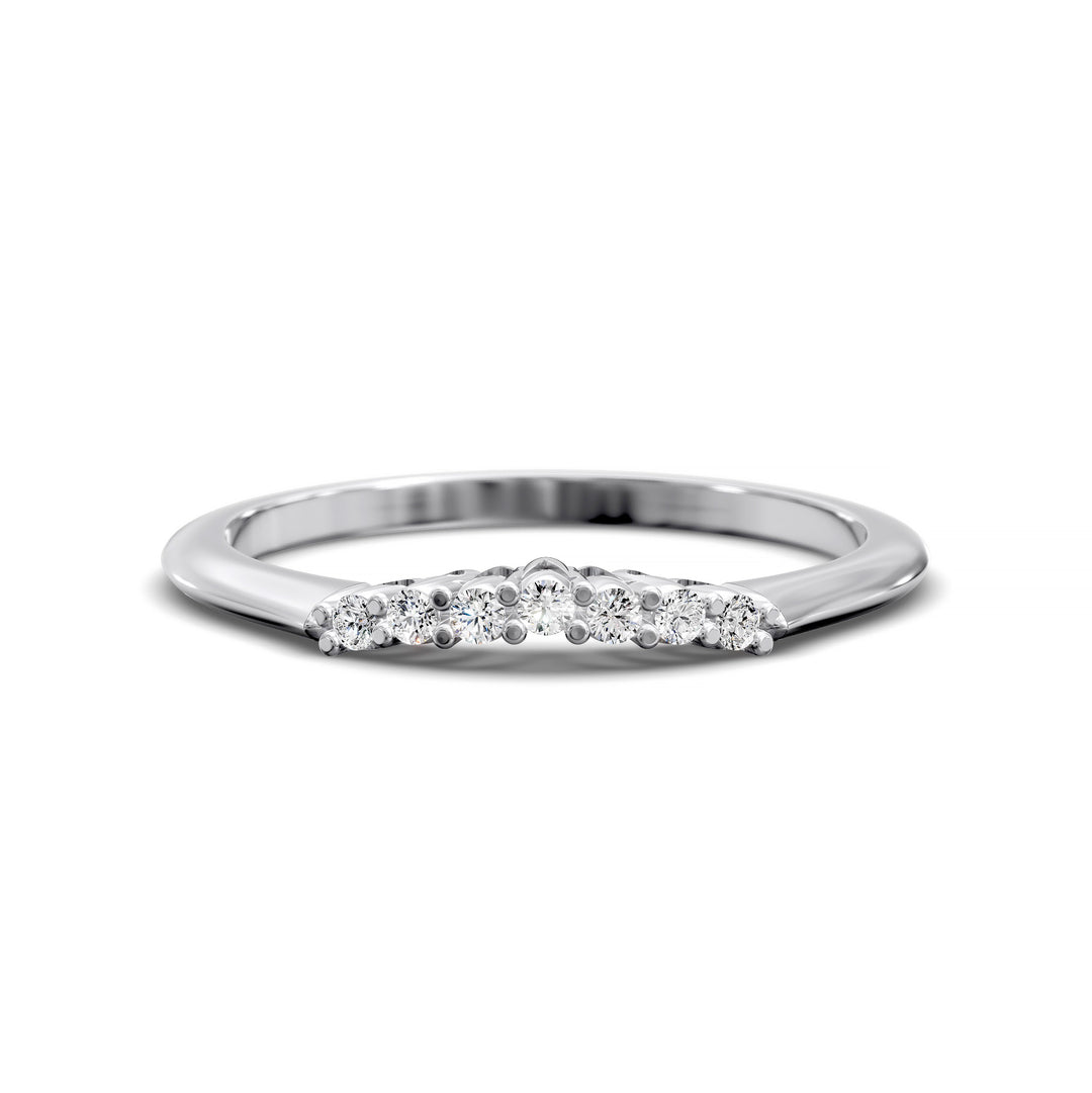 Curved diamond wedding band with shared-prong setting and open gallery, featuring seven round stones