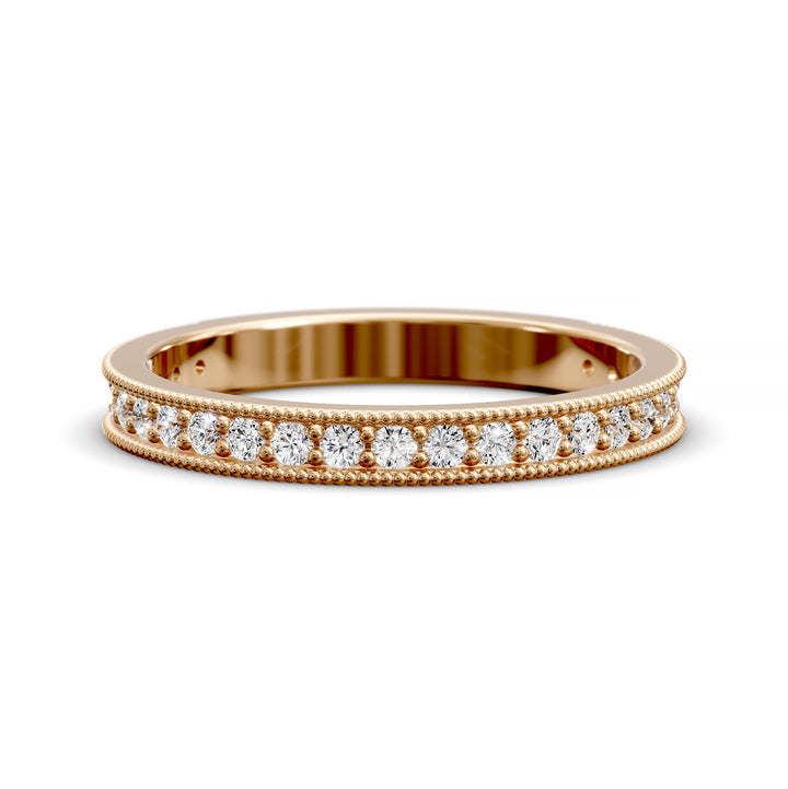 Channel set diamond wedding band with three-quarter eternity and beaded edge