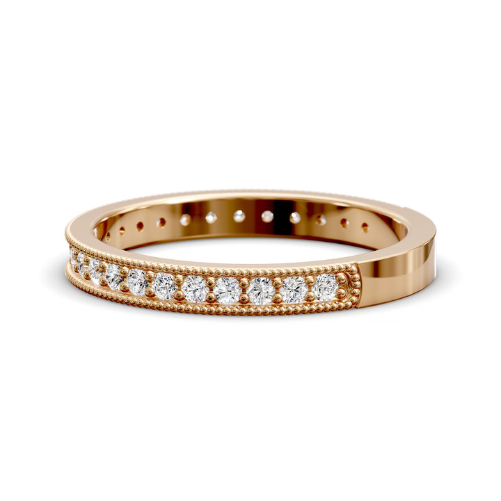 Channel set diamond wedding band with three-quarter eternity and beaded edge