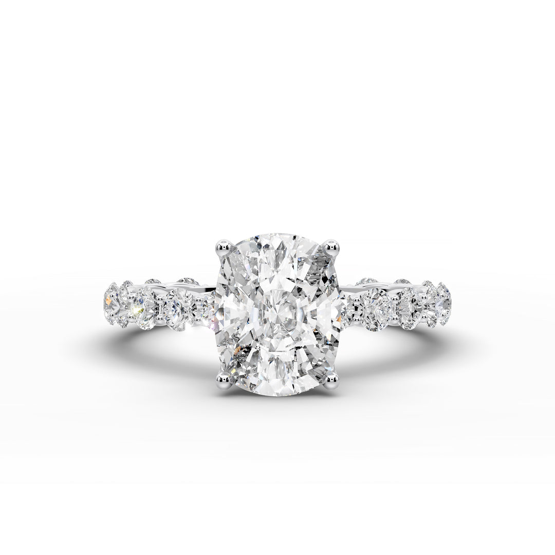 Elongated cushion diamond engagement ring with shared prong band shown in a studio display.