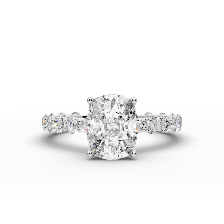 Elongated cushion diamond engagement ring with shared prong band shown in a studio display.