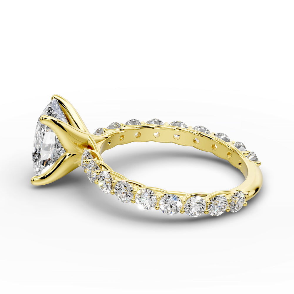 Elongated cushion diamond engagement ring with shared prong band shown in a studio display.