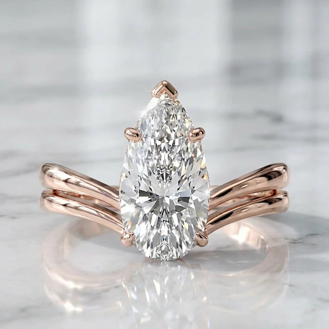 2.5 carat elongated pear lab diamond double band solitaire engagement ring on marbel.
