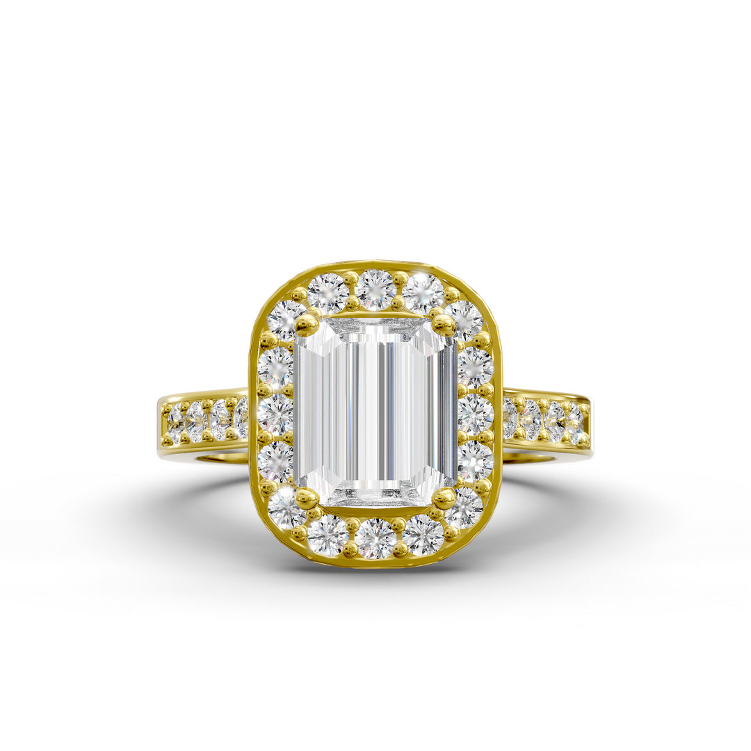 Emerald-cut diamond halo engagement ring with channel-set diamond band shown in studio lighting.