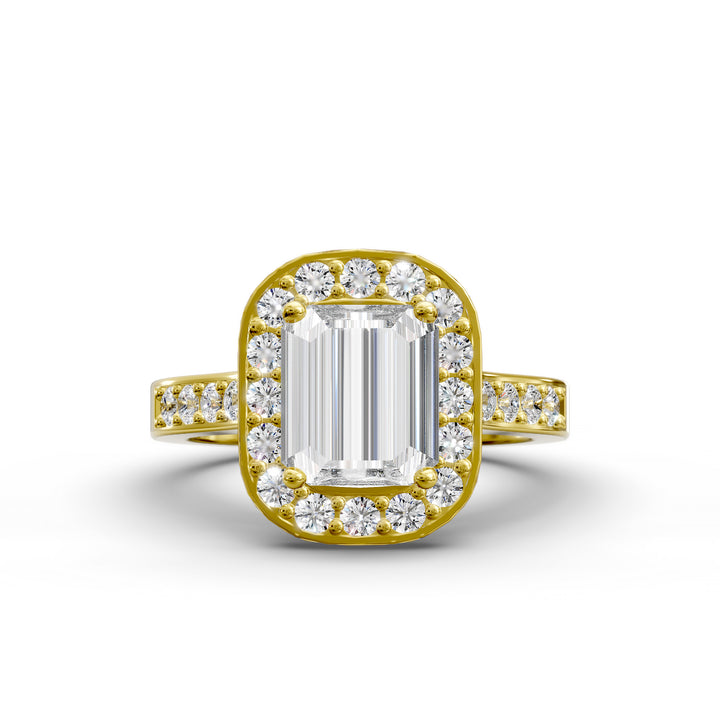 Emerald-cut diamond halo engagement ring with channel-set diamond band shown in studio lighting.