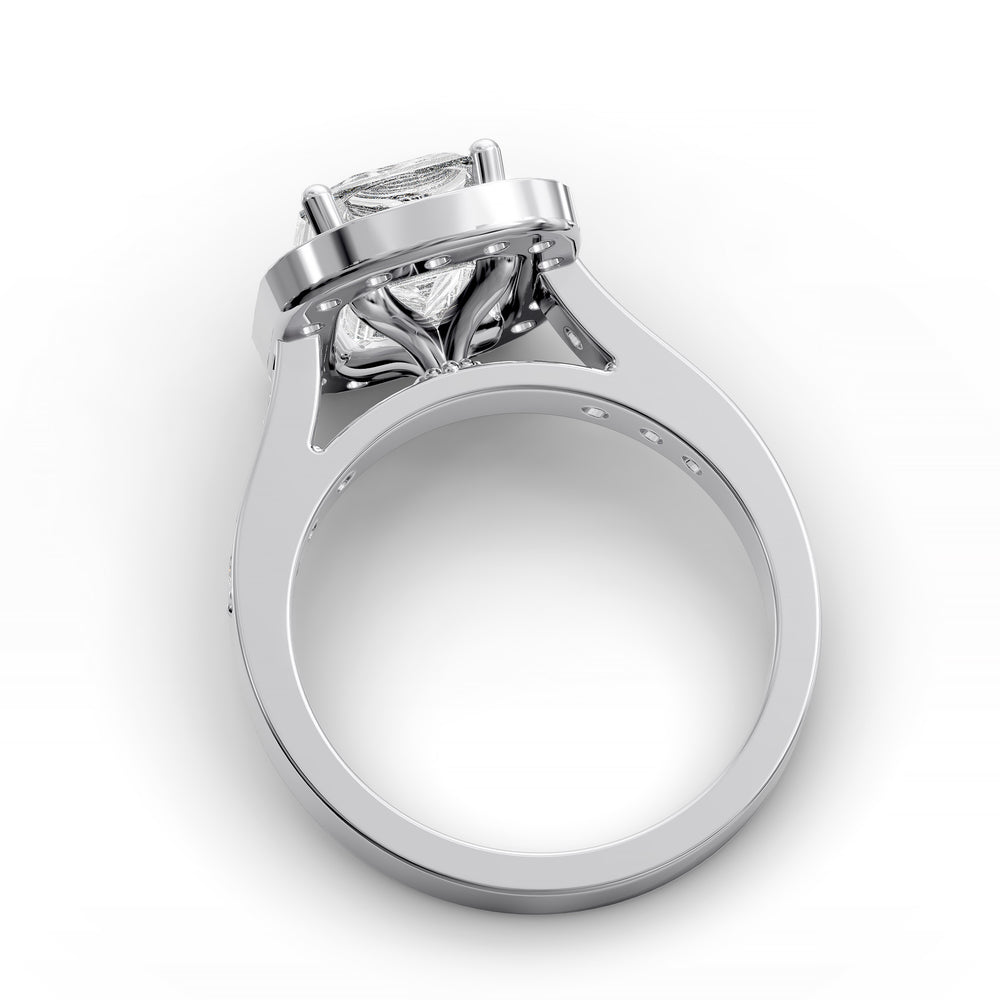 Emerald-cut diamond halo engagement ring with channel-set diamond band shown in studio lighting.