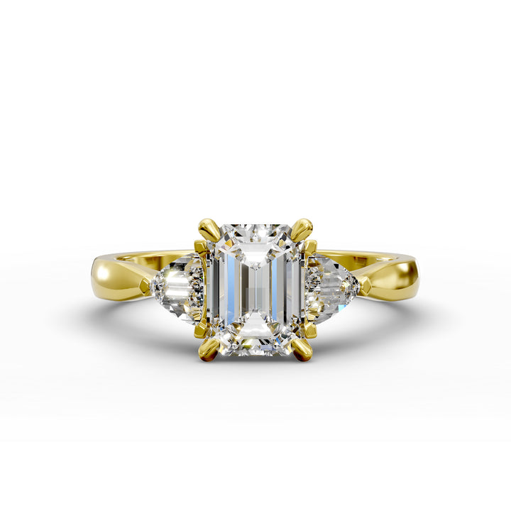 emerald-cut three-stone engagement ring with trapezoid side diamonds and tapered band shown from multiple angles