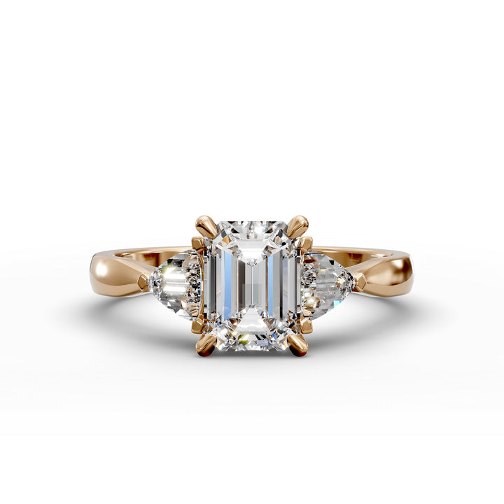 emerald-cut three-stone engagement ring with trapezoid side diamonds and tapered band shown from multiple angles