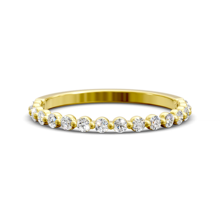 Floating diamond shared prong wedding band with round stones in gold