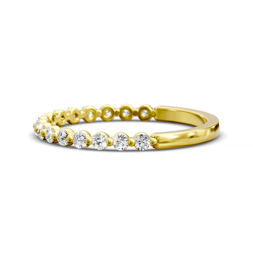 Floating diamond shared prong wedding band with round stones in gold
