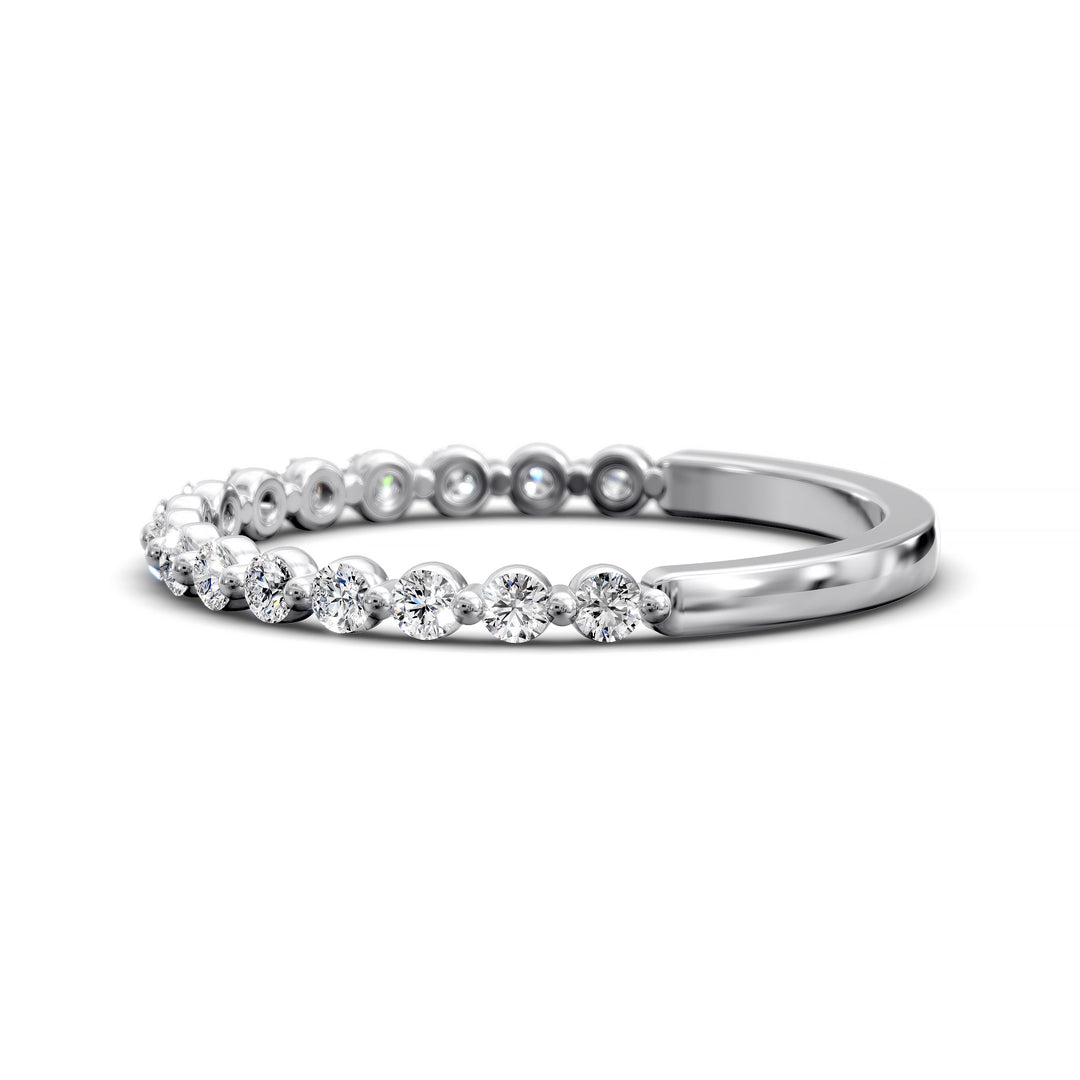 Floating diamond shared prong wedding band with round stones in gold
