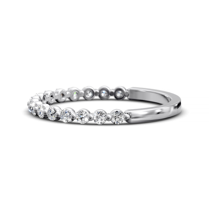 Floating diamond shared prong wedding band with round stones in gold