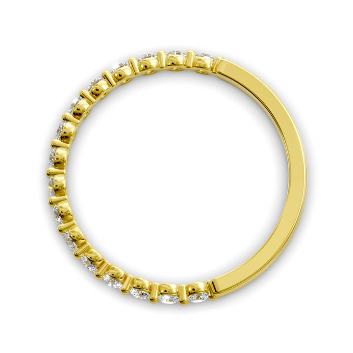 Floating diamond shared prong wedding band with round stones in gold