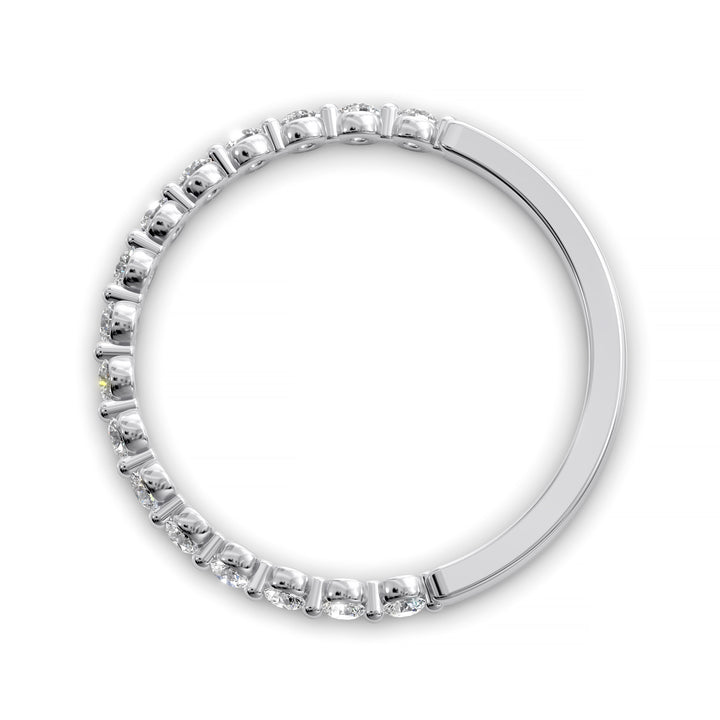 Floating diamond shared prong wedding band with round stones in gold