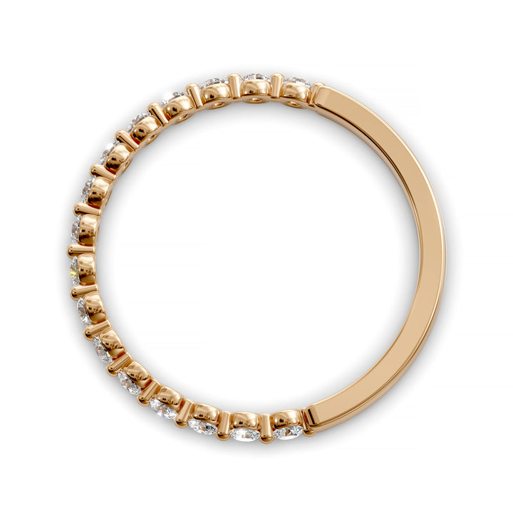 Floating diamond shared prong wedding band with round stones in gold