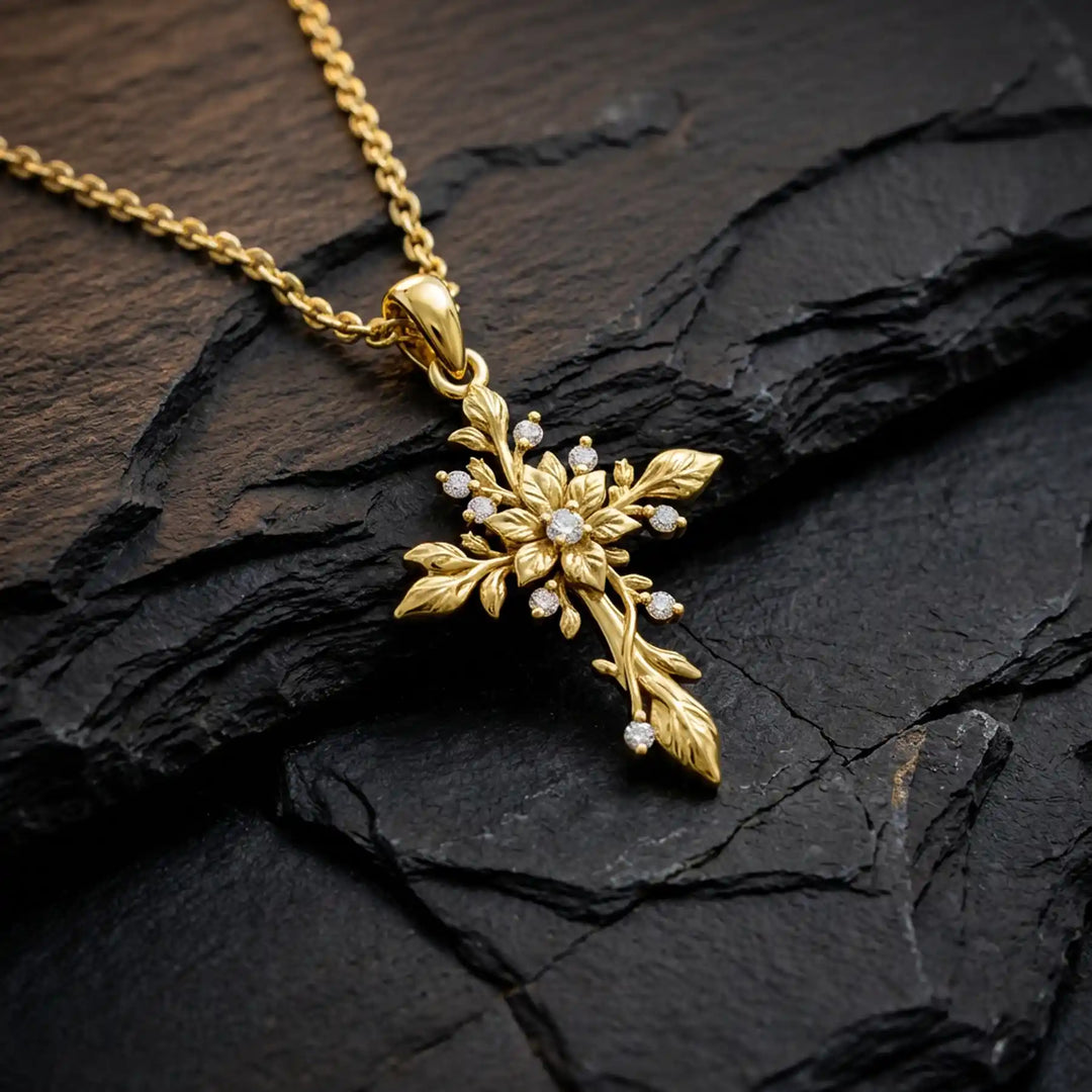 Floral cross lab-grown diamond pendant displayed on black stone.