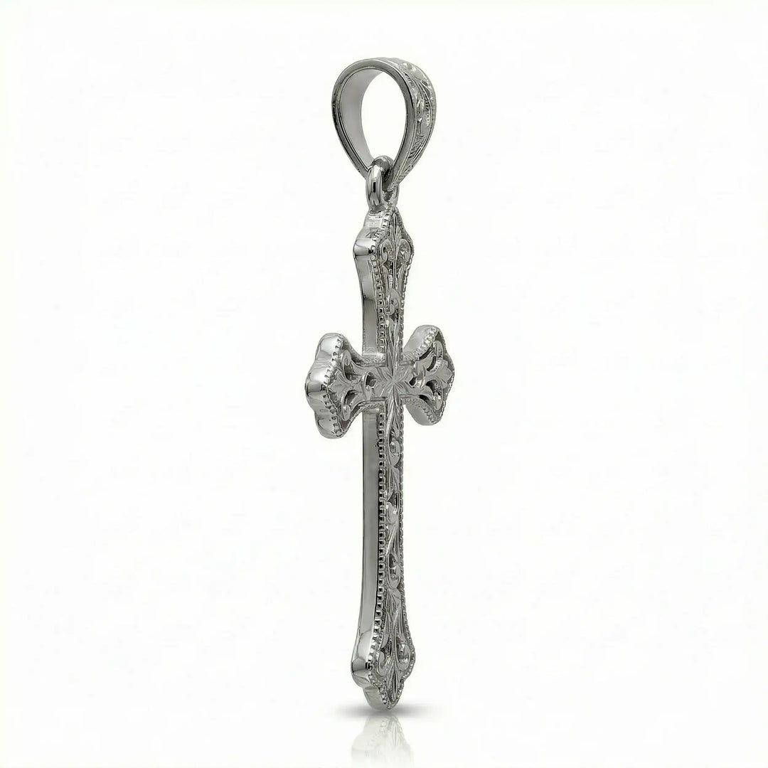 Ornate Gothic cross pendant necklace with engraved vintage-style detailing displayed on white background.