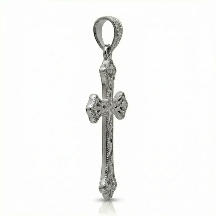 Ornate Gothic cross pendant necklace with engraved vintage-style detailing displayed on white background.