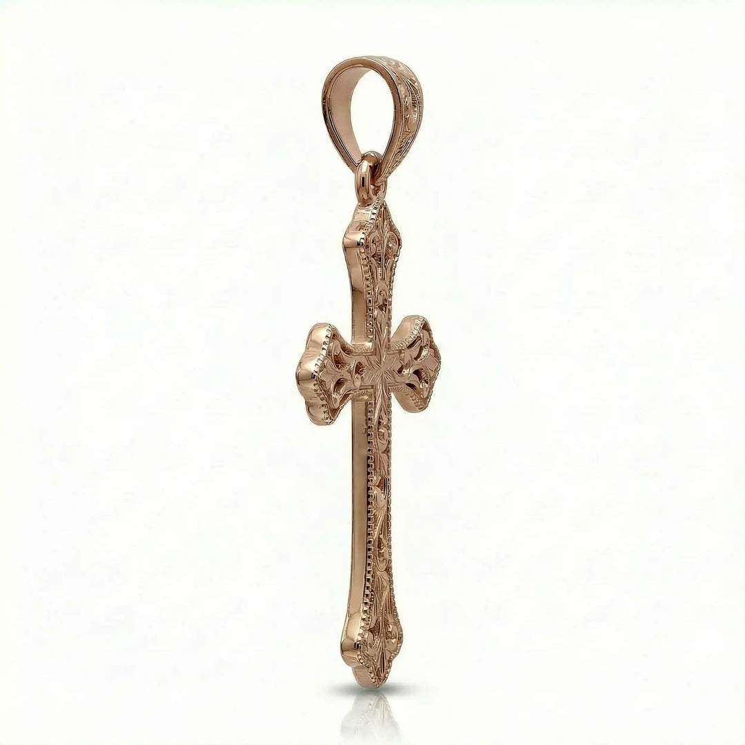 Ornate Gothic cross pendant necklace with engraved vintage-style detailing displayed on white background.