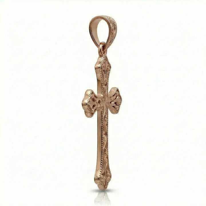 Ornate Gothic cross pendant necklace with engraved vintage-style detailing displayed on white background.