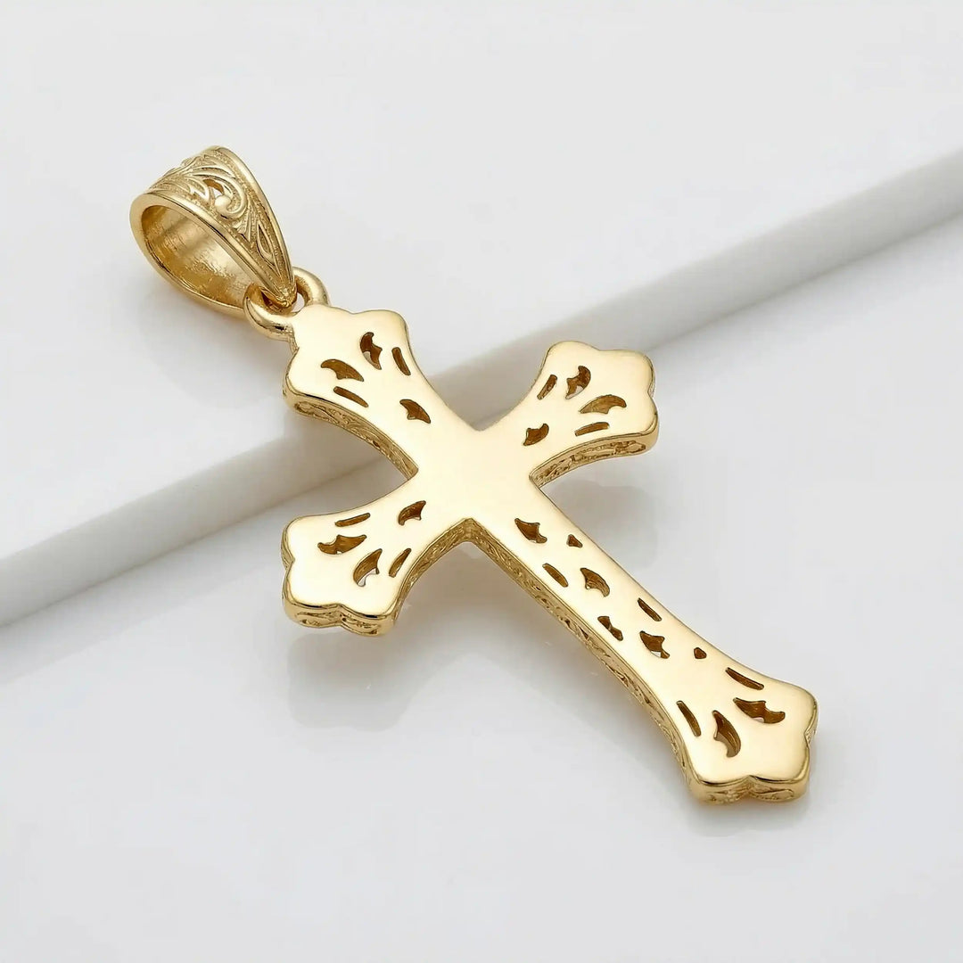 Ornate Gothic cross pendant necklace with engraved vintage-style detailing displayed on white background.