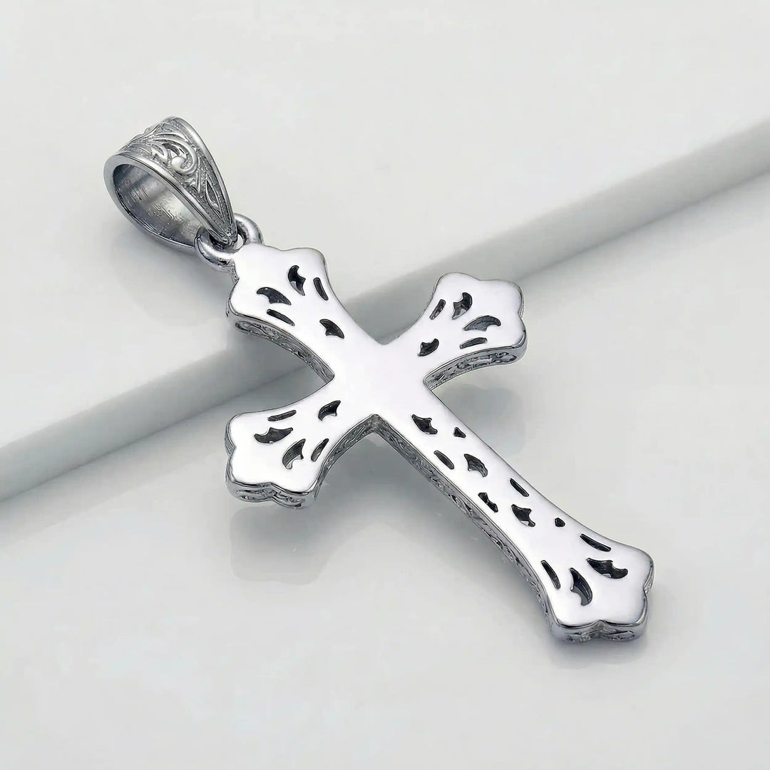 Ornate Gothic cross pendant necklace with engraved vintage-style detailing displayed on white background.