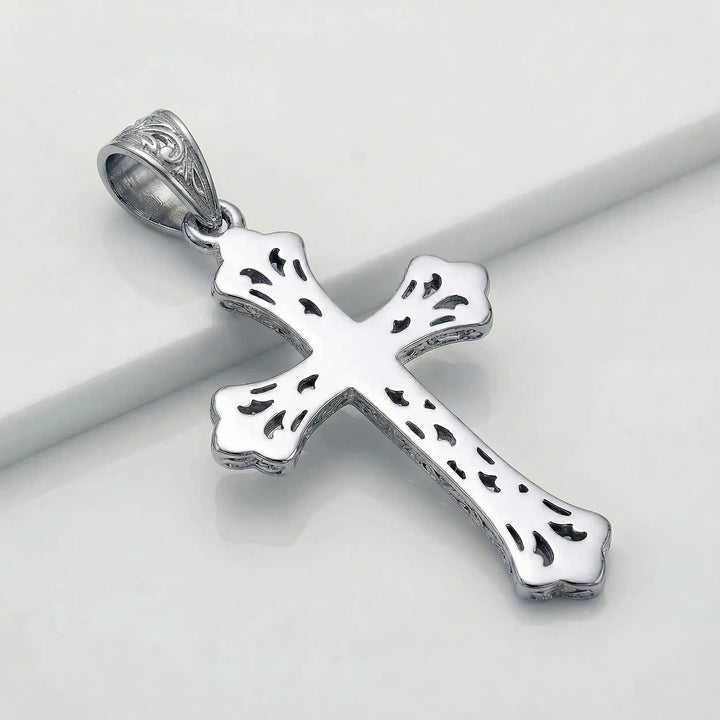 Ornate Gothic cross pendant necklace with engraved vintage-style detailing displayed on white background.