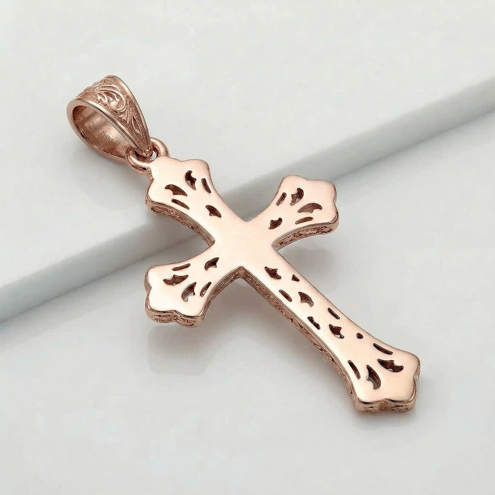 Ornate Gothic cross pendant necklace with engraved vintage-style detailing displayed on white background.
