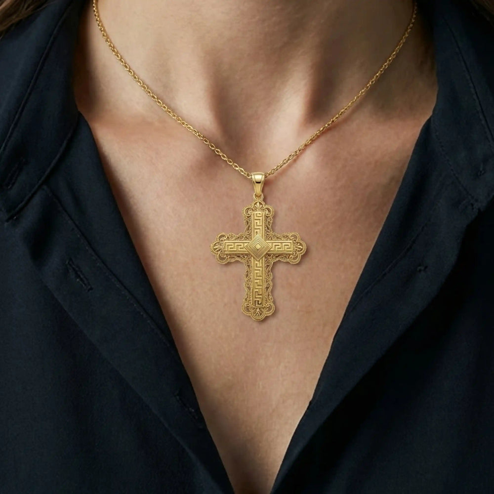 Ornate Greek cross pendant necklace with intricate decorative patterns displayed on chest.