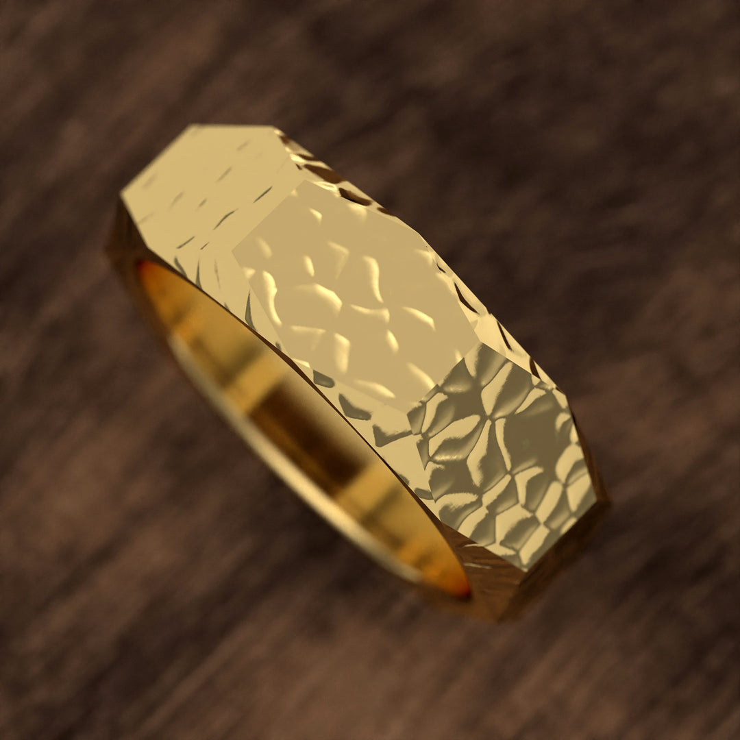 hammered hexagonal men’s wedding band with faceted texture