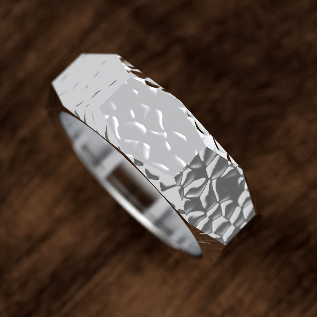 hammered hexagonal men’s wedding band with faceted texture