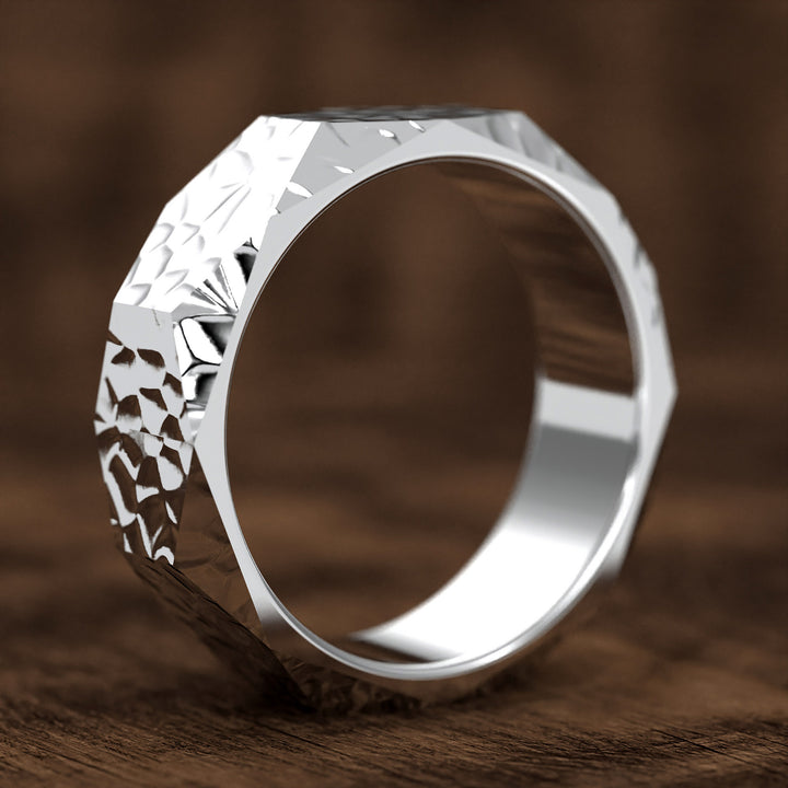 hammered hexagonal men’s wedding band with faceted texture