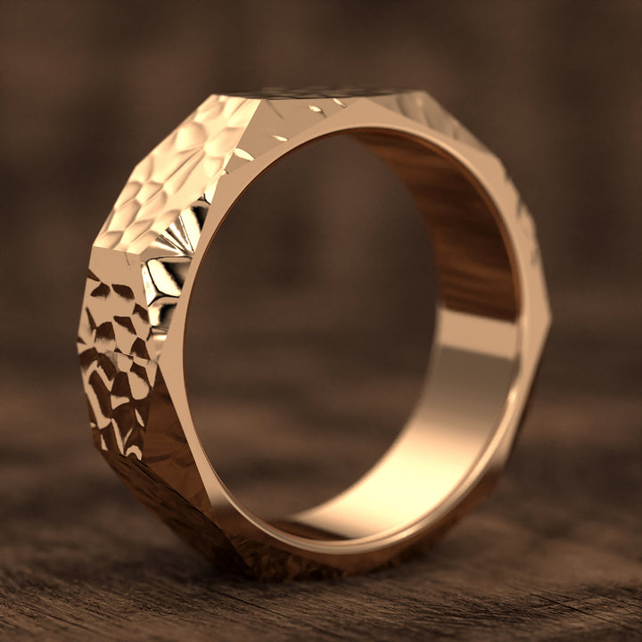 hammered hexagonal men’s wedding band with faceted texture