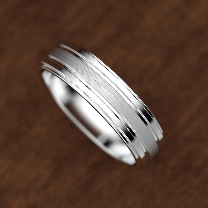 men’s band with ice-cut textured center and polished dual grooves