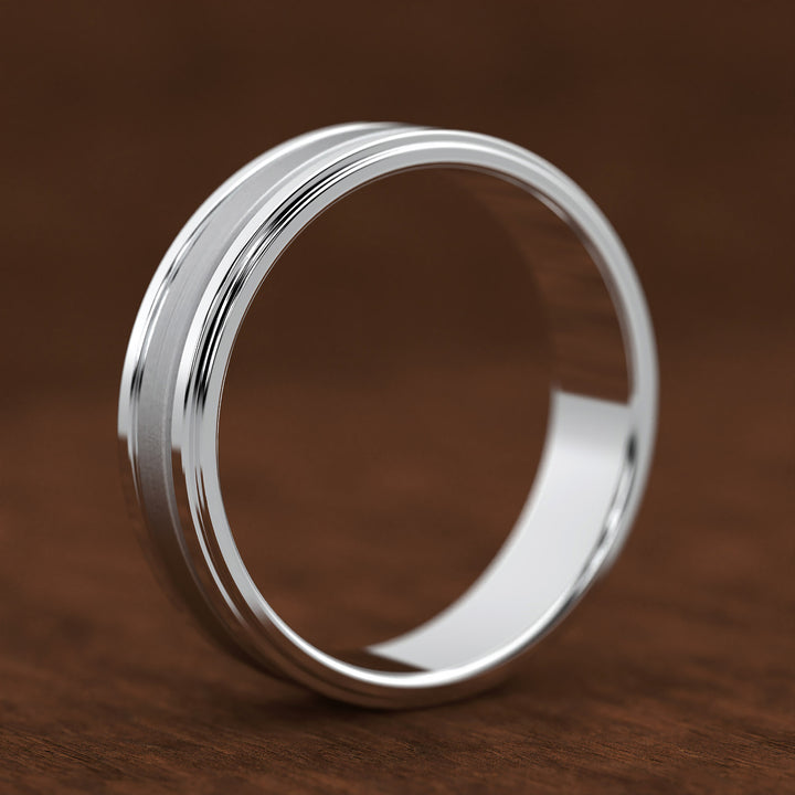 men’s band with ice-cut textured center and polished dual grooves