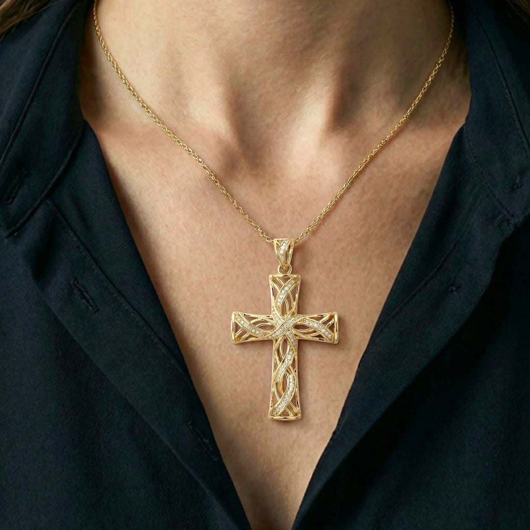 Lab-grown diamond Latin cross pendant with openwork design displayed on chest.