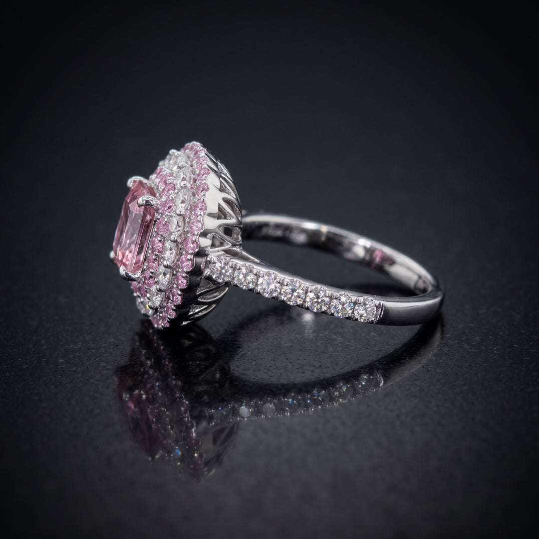 0.50 CT round lab diamond engagement ring with pink sapphire and moissanite halo on 14K gold.