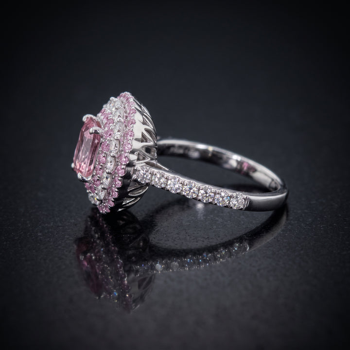 0.50 CT round lab diamond engagement ring with pink sapphire and moissanite halo on 14K gold.