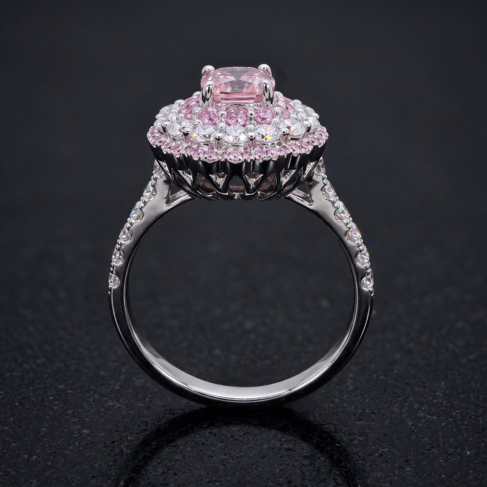 0.50 CT round lab diamond engagement ring with pink sapphire and moissanite halo on 14K gold.