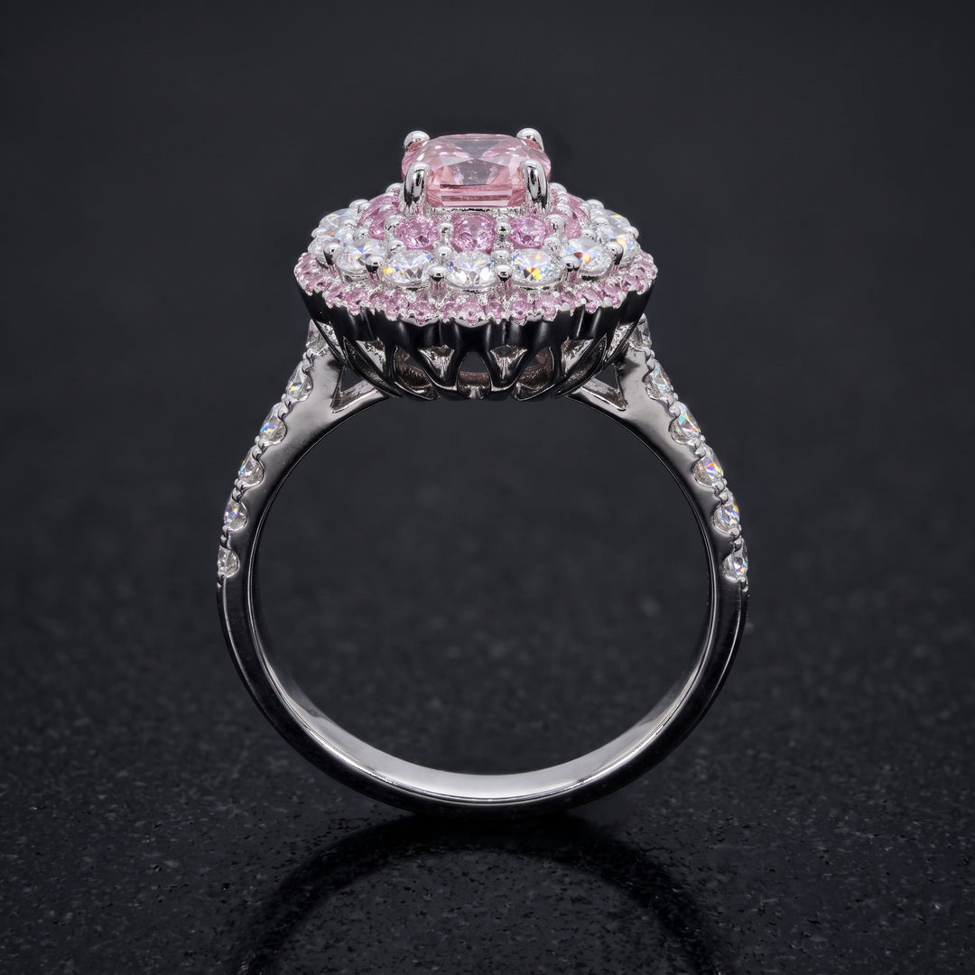0.50 CT round lab diamond engagement ring with pink sapphire and moissanite halo on 14K gold.