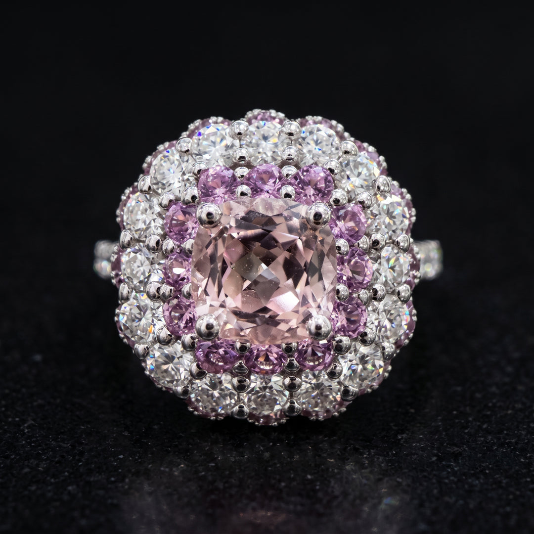 0.50 CT round lab diamond engagement ring with pink sapphire and moissanite halo on 14K gold.