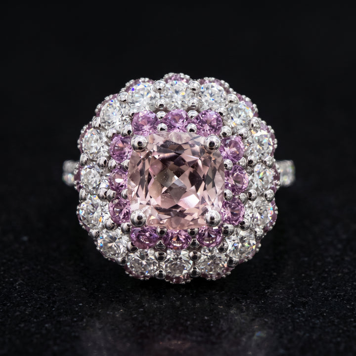 0.50 CT round lab diamond engagement ring with pink sapphire and moissanite halo on 14K gold.