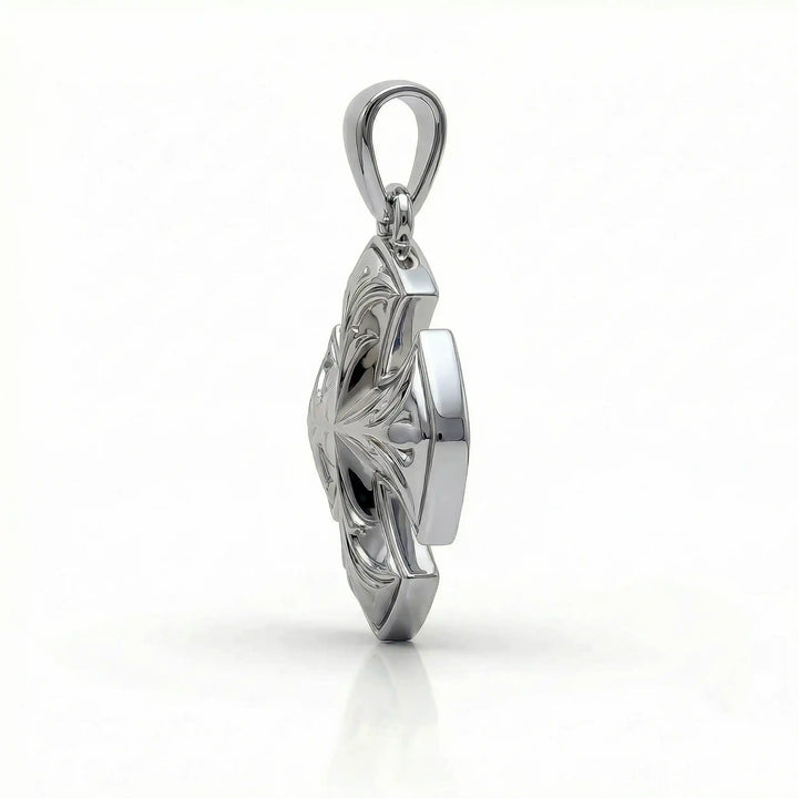 Maltese cross pendant with engraved ornamental design displayed on white background.