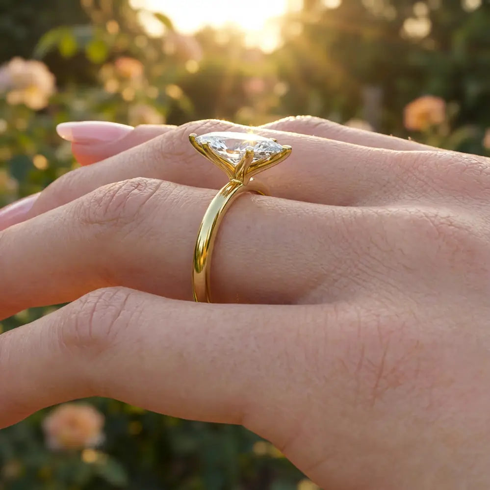 Marquise diamond six-prong solitaire engagement ring shown on a classic polished band.