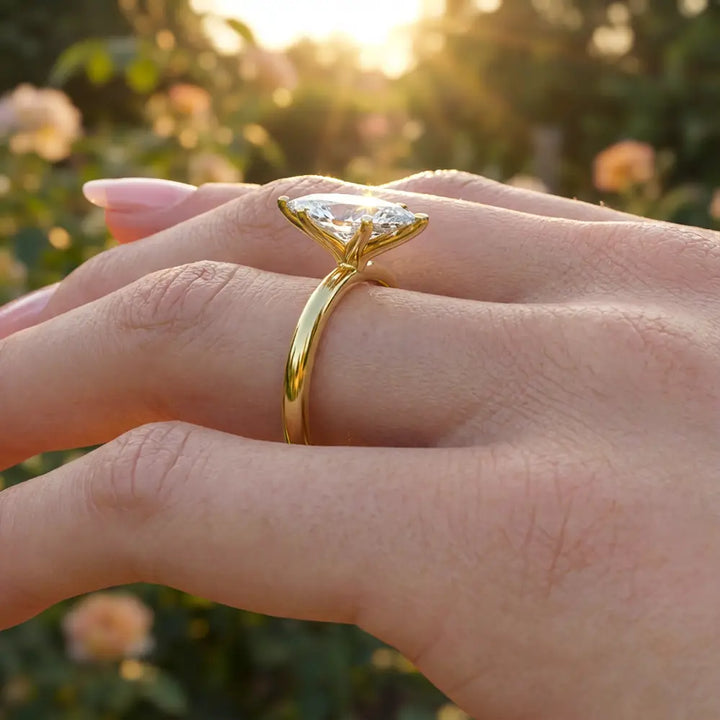 Marquise diamond six-prong solitaire engagement ring shown on a classic polished band.